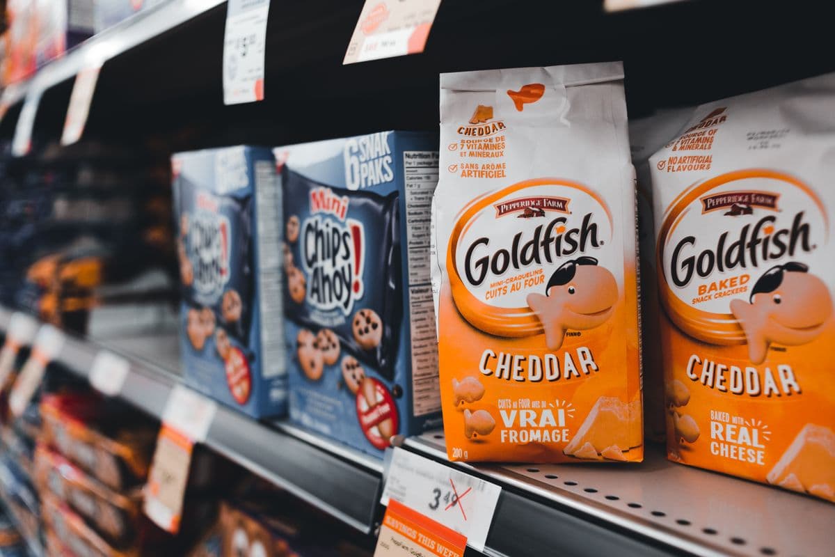 Price labels on a stocked shelf of business supplies