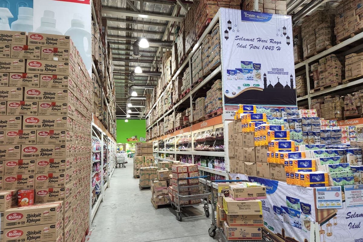 High warehouse shelves stocked with a variety of boxed merchandise