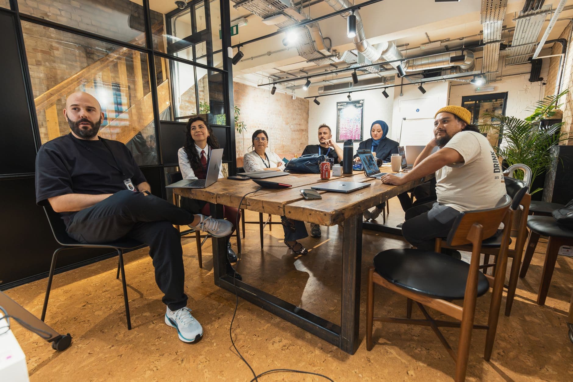 Small business team meeting around a table in a modern office