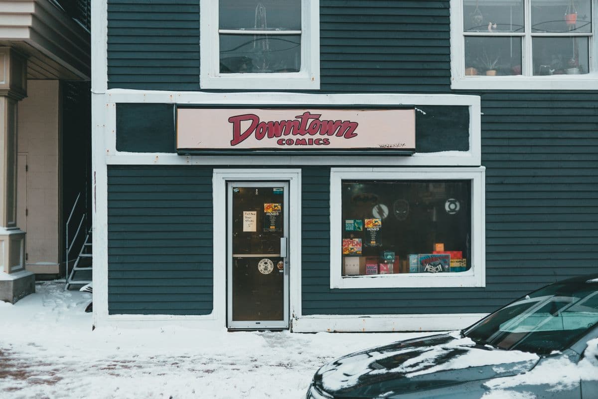 Row of small retail storefronts on a high street