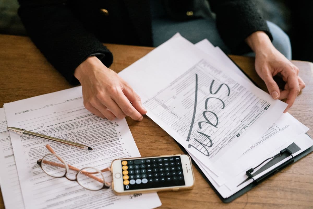 Tax exemption forms and a calculator on a desk