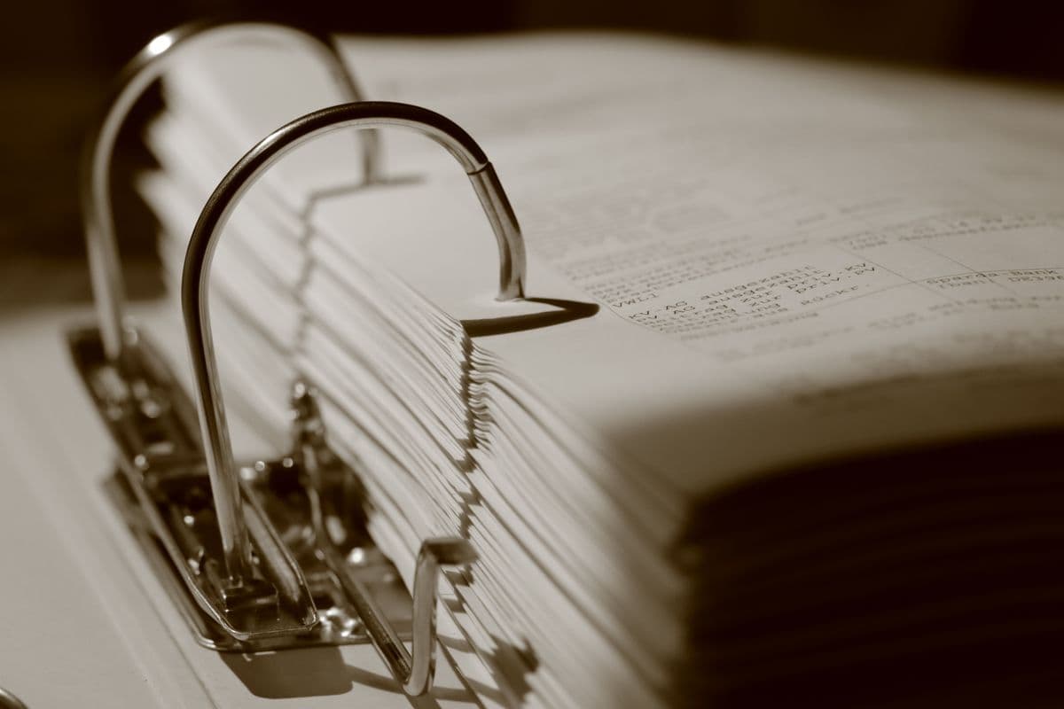 Stack of receipts and filing folders in an office