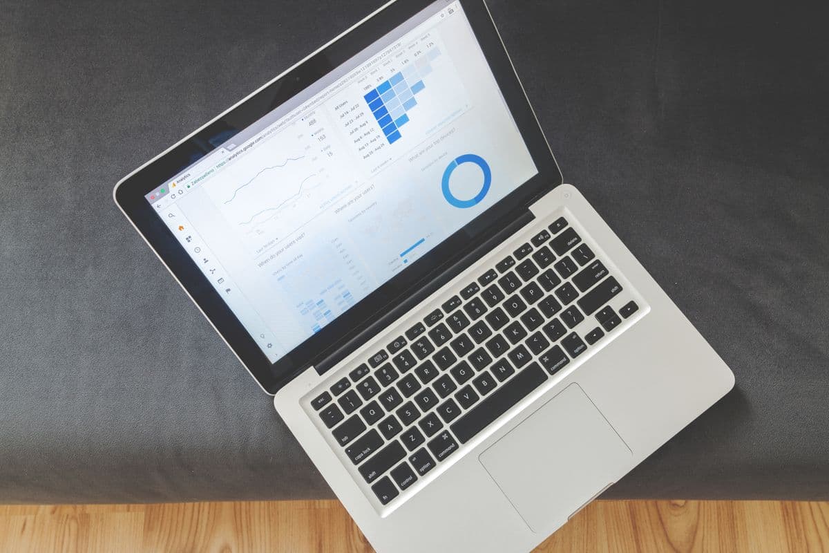 Laptop showing an accounting dashboard on a small business desk