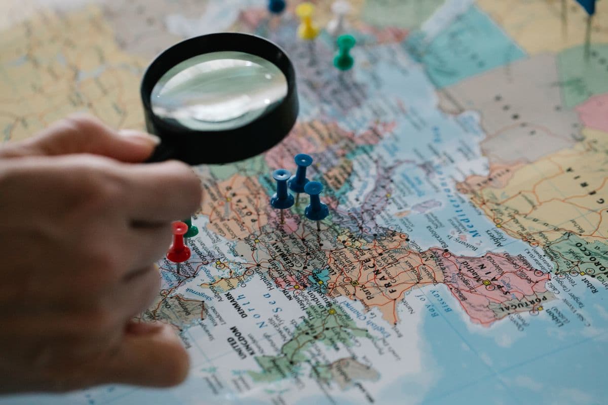 Delivery route planning with map pins on a desk