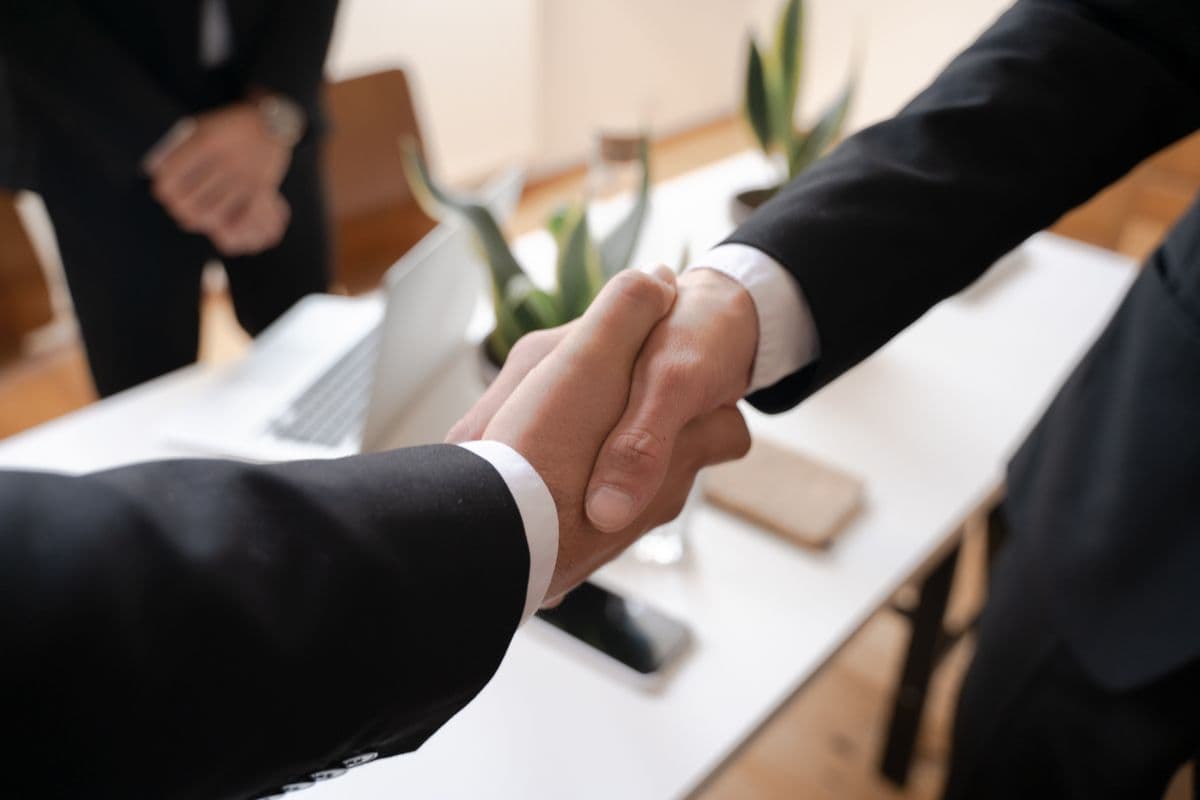 Two people discussing a large order in a warehouse office