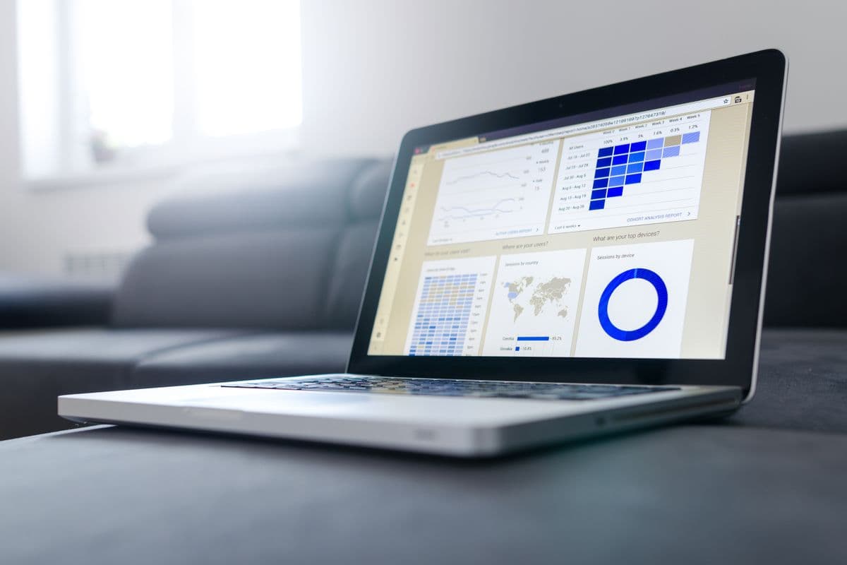 Monitor displaying spend analytics charts in an office